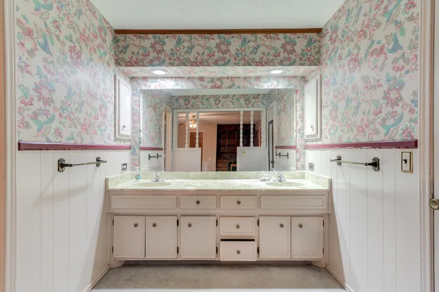 a bathroom with a shower and a door