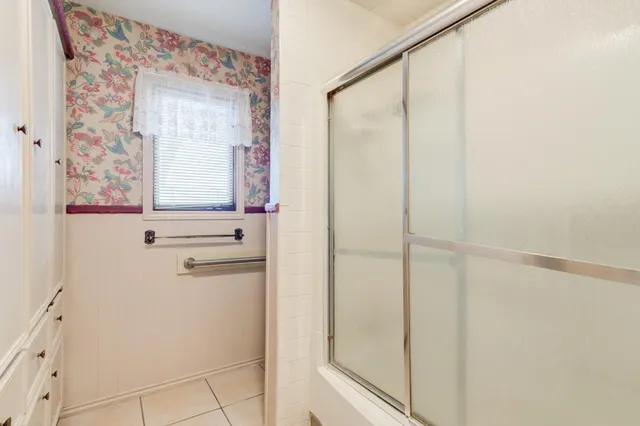 a view of an empty room with a wooden door