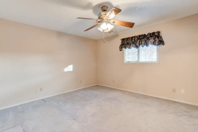 a view of an empty walk in closet