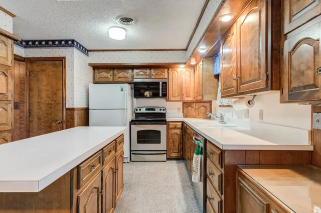 a kitchen that has a cabinets and a stove