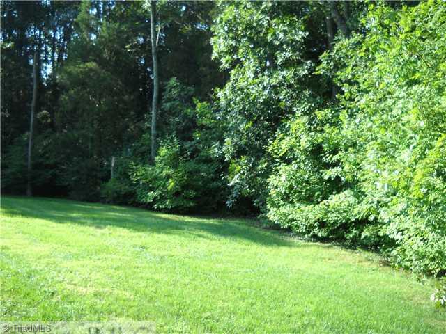 142 Old Mill Road, Unit D High Point, NC 27265 - Photo 12 of 16 Yard/Garden. Back of the townhouse is surrounded by beautifull lawn and wooded area for additional privacy and a peaceful atmosphere