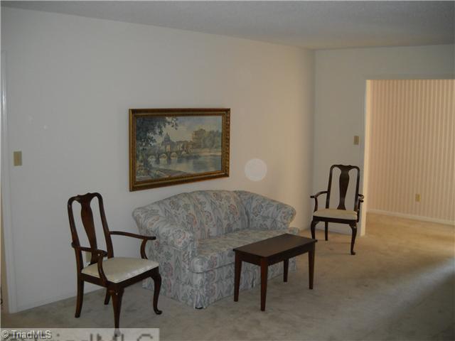 142 Old Mill Road, Unit D High Point, NC 27265 - Photo 5 of 16 Living Room. Entry foyer with wood floors is located to the right of the doorway in this photo.