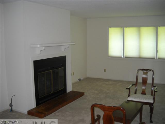 142 Old Mill Road, Unit D High Point, NC 27265 - Photo 6 of 16 Living Room. Spacious living room is painted neutral. Gas log fireplace. Window shades included also.