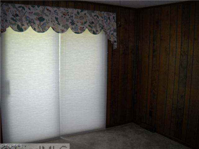 142 Old Mill Road, Unit D High Point, NC 27265 - Photo 8 of 16 Den/Family/Great Room. Also can be a third bedroom, the den has sliding doors that open to the deck beyond.
