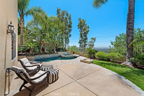 a view of a backyard with sitting area