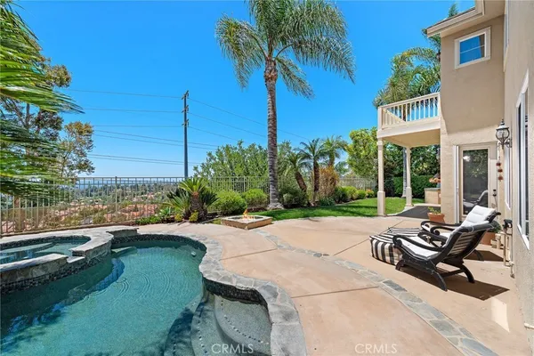 a house with a garden and swimming pool