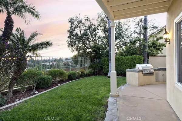 a view of a patio with a yard