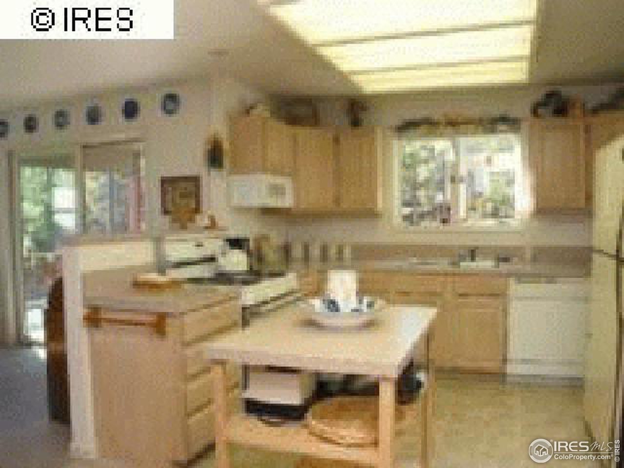 3636 Davis Ranch Road Bellvue, CO 80512 - Photo 2 of 11 a kitchen with a sink a stove and cabinets