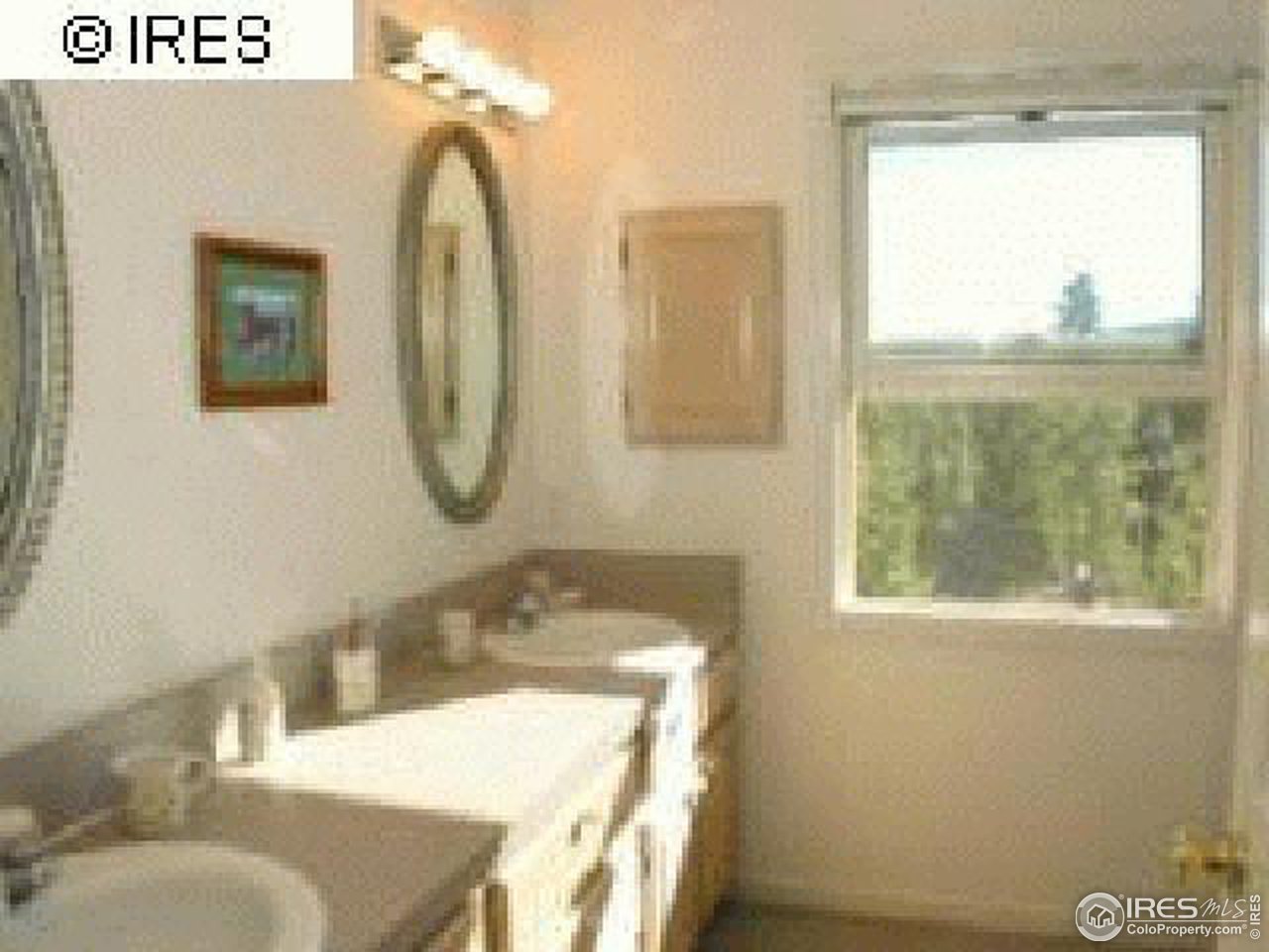 3636 Davis Ranch Road Bellvue, CO 80512 - Photo 6 of 11 a bathroom with a granite countertop sink and a mirror