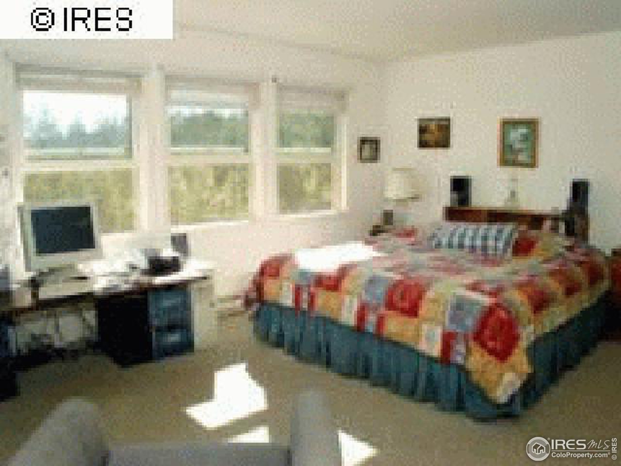 3636 Davis Ranch Road Bellvue, CO 80512 - Photo 7 of 11 a bedroom with a bed window and couch