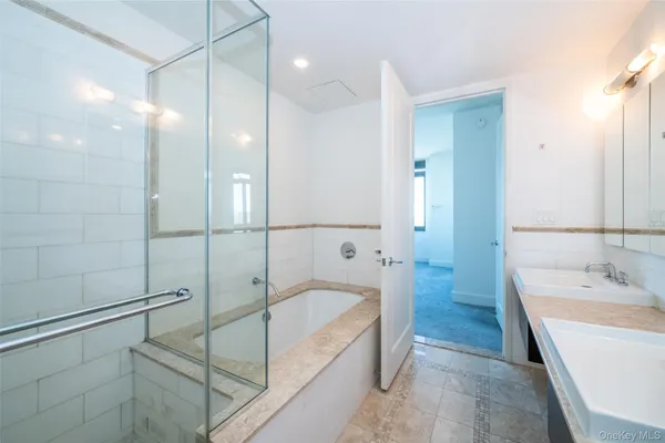 a bathroom with a bathtub and a sink