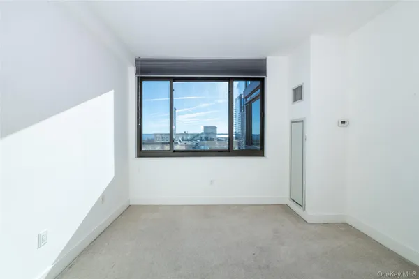 a view of an empty room with a window