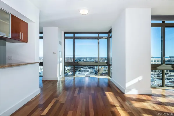 a view of a room with wooden floor