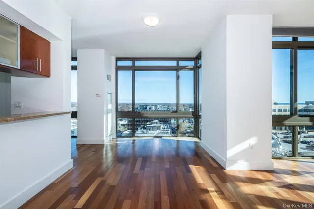 a view of a room with wooden floor