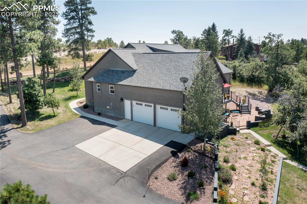 15721 South Furrow Road Larkspur, CO 80118 - Photo 12 of 50 a view of house with a outdoor space