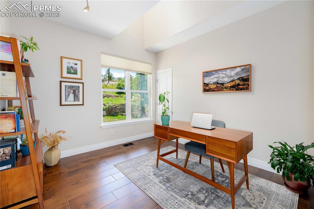 15721 South Furrow Road Larkspur, CO 80118 - Photo 28 of 50 a workspace with furniture and window