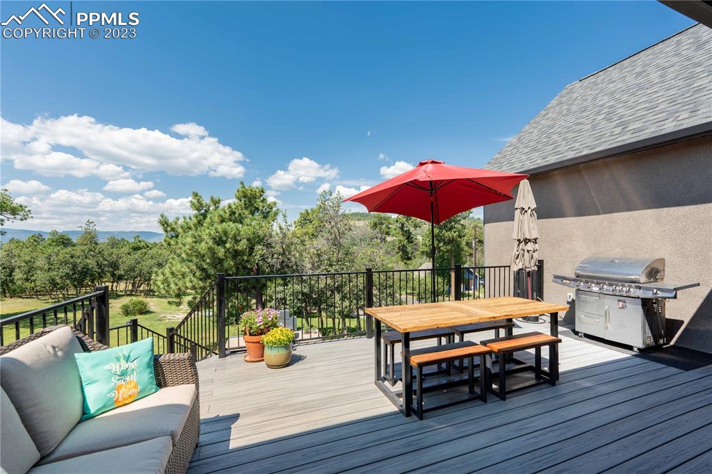 15721 South Furrow Road Larkspur, CO 80118 - Photo 38 of 50 a view of a roof deck with furniture