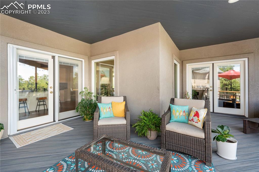 15721 South Furrow Road Larkspur, CO 80118 - Photo 39 of 50 a living room with furniture and a potted plant