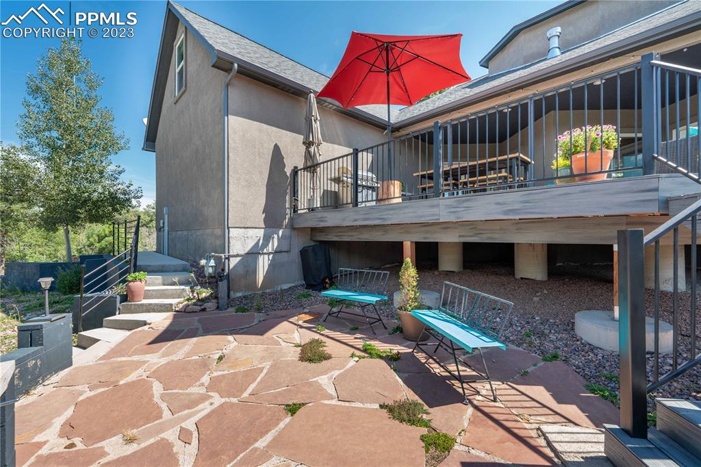 15721 South Furrow Road Larkspur, CO 80118 - Photo 40 of 50 a view of house with outdoor seating space