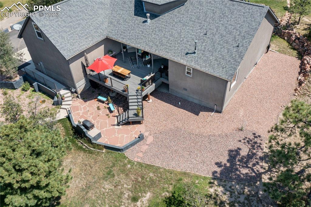 15721 South Furrow Road Larkspur, CO 80118 - Photo 43 of 50 an aerial view of a house with a yard and sitting space