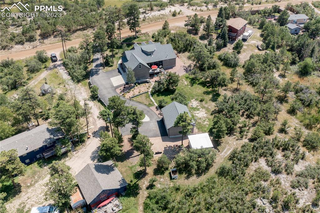 15721 South Furrow Road Larkspur, CO 80118 - Photo 44 of 50 an aerial view of a house with a yard