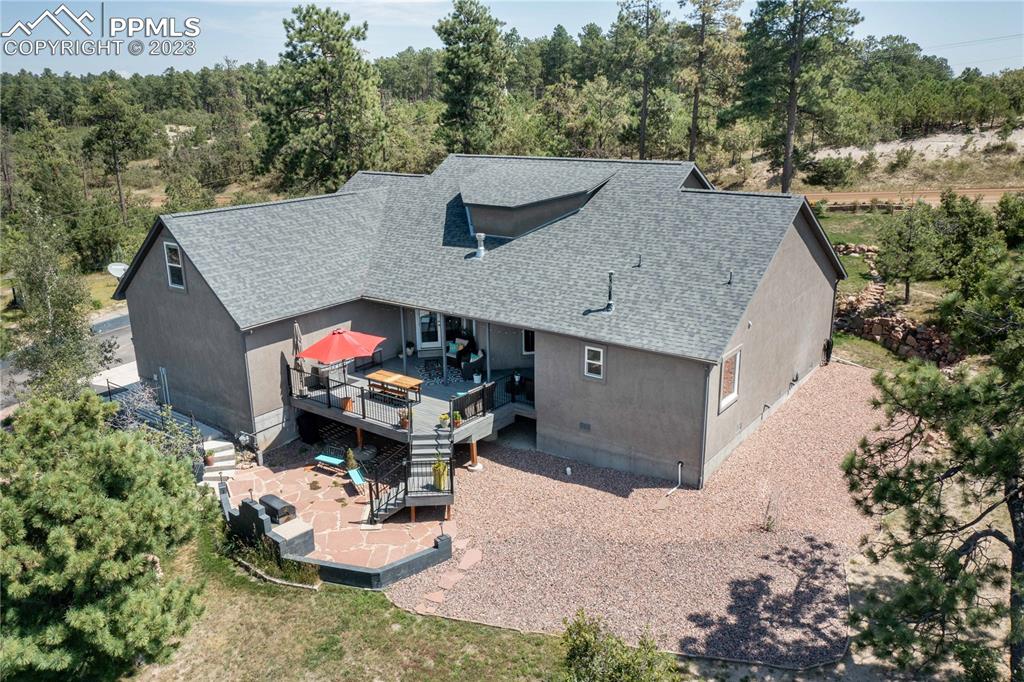 15721 South Furrow Road Larkspur, CO 80118 - Photo 6 of 50 an aerial view of a house with table and chairs