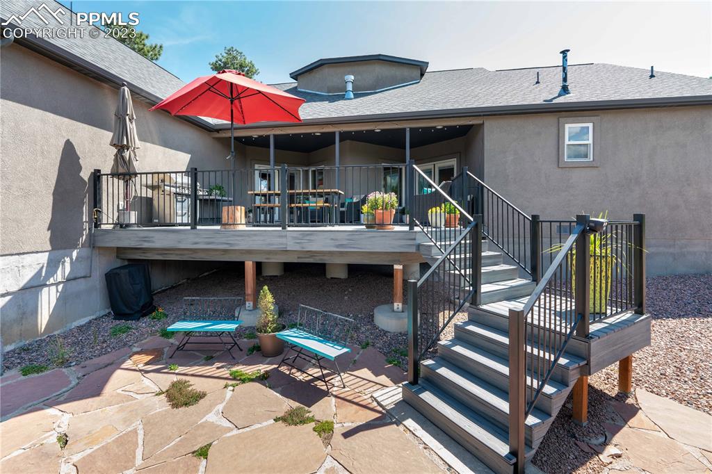15721 South Furrow Road Larkspur, CO 80118 - Photo 7 of 50 a view of a chairs and table in the patio