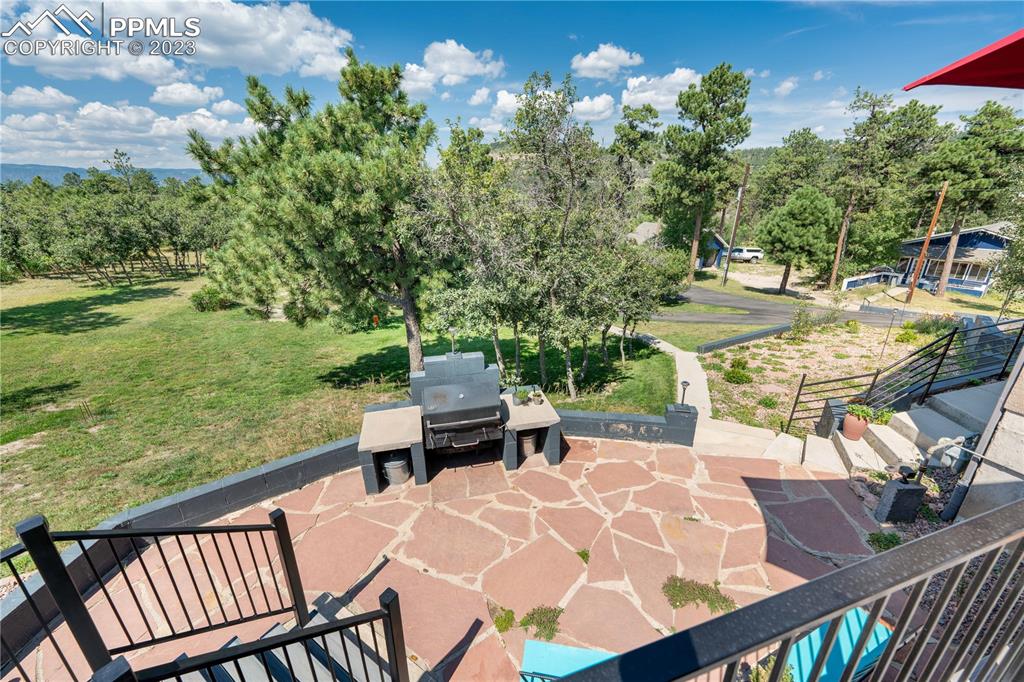 15721 South Furrow Road Larkspur, CO 80118 - Photo 9 of 50 a view of an outdoor sitting area with swimming pool