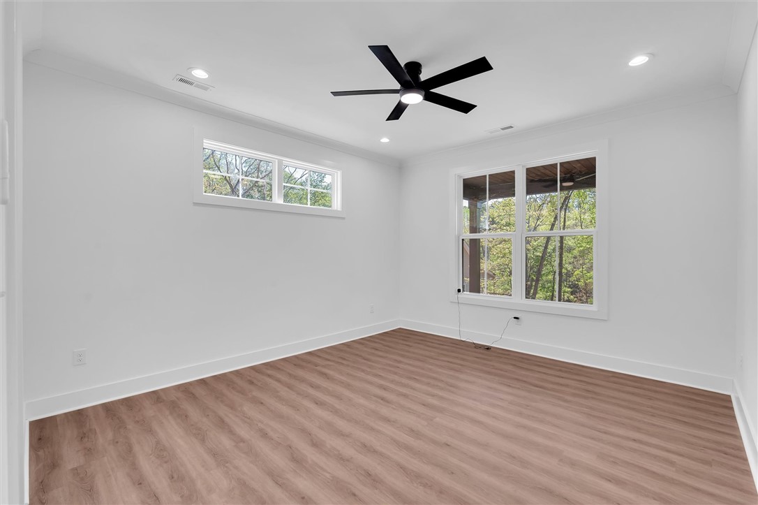 407 Blue Ridge Court Westminster, SC 29693 - Photo 23 of 48 This spacious room features ample natural light and durable flooring, offering a comfortable living space.