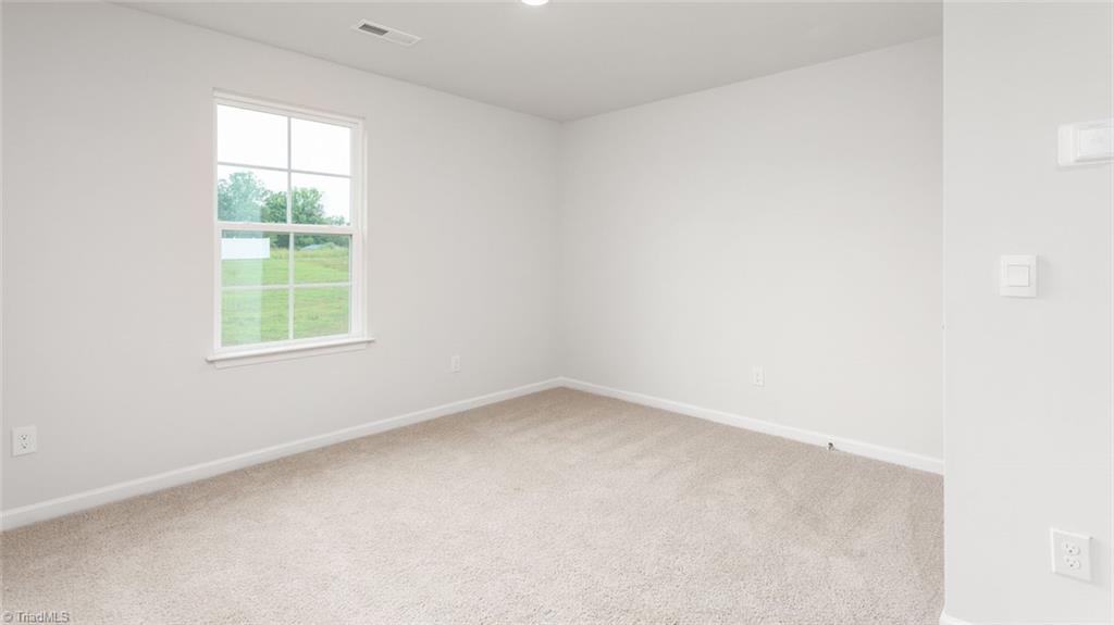 142 West Farm Loop Stokesdale, NC 27357 - Photo 13 of 23 This home model is a representation of it's residential design