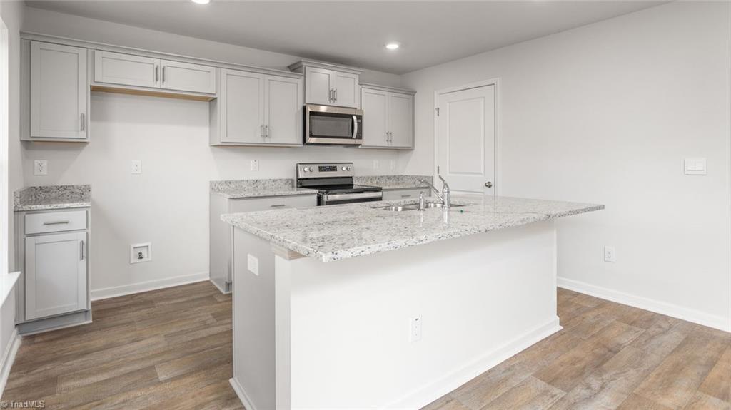 142 West Farm Loop Stokesdale, NC 27357 - Photo 7 of 23 This home model is a representation of it's residential design