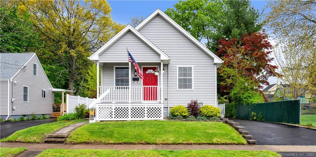 86 Henry Street New Britain, CT 06051 - Photo 1 of 1 a front view of a house with a yard