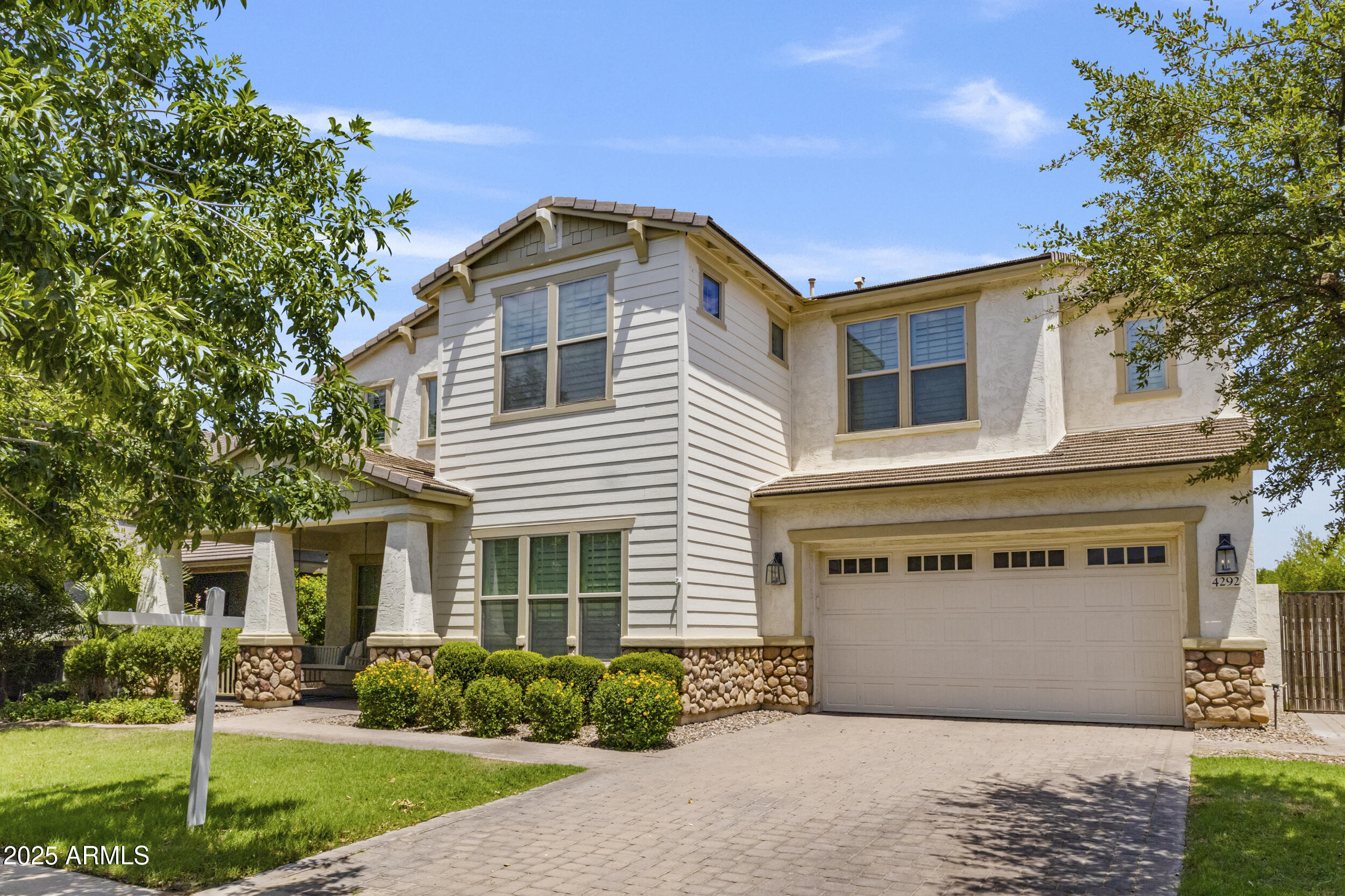 4292 East Morrison Ranch Parkway Gilbert, AZ 85296 - Photo 1 of 55 a front view of a house with garden