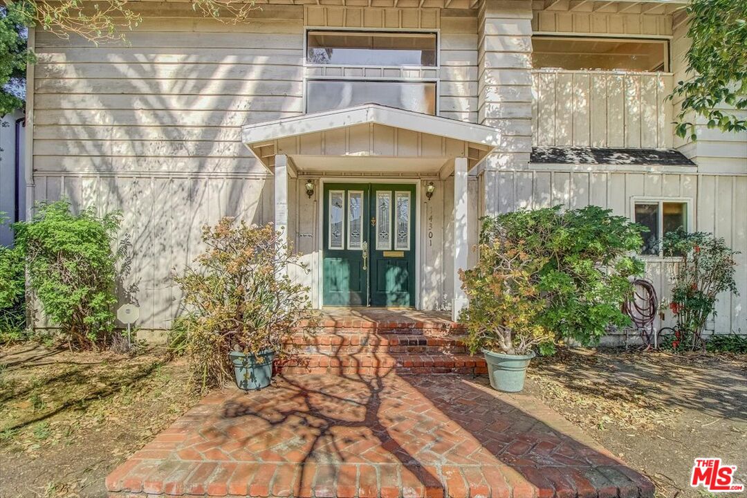 14301 Hortense Street Sherman Oaks, CA 91423 - Photo 1 of 32 a front view of a house with a yard