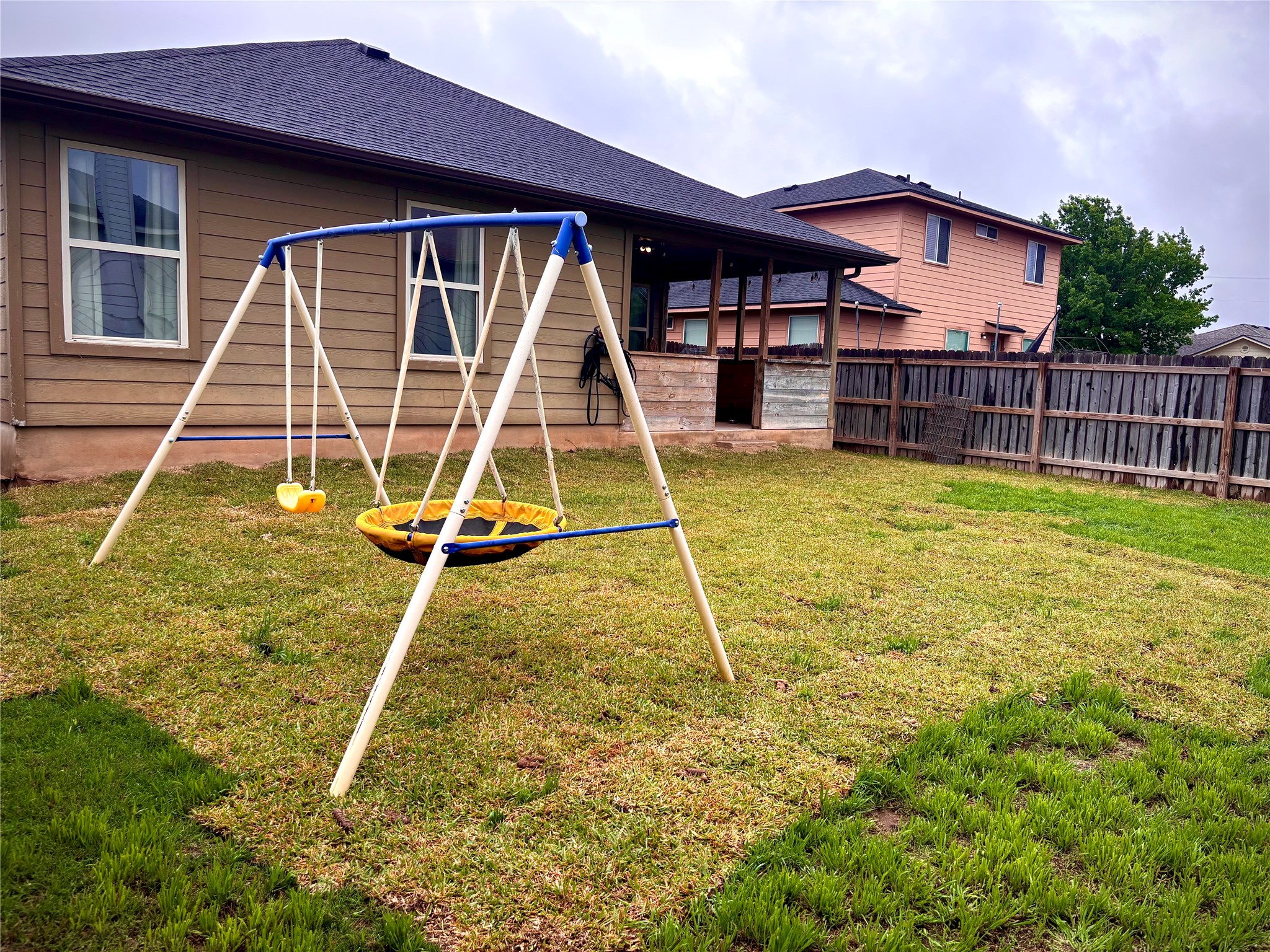 606 Old Peak Road Georgetown, TX 78626 - Photo 16 of 16 a view of a house with a backyard and a wooden deck