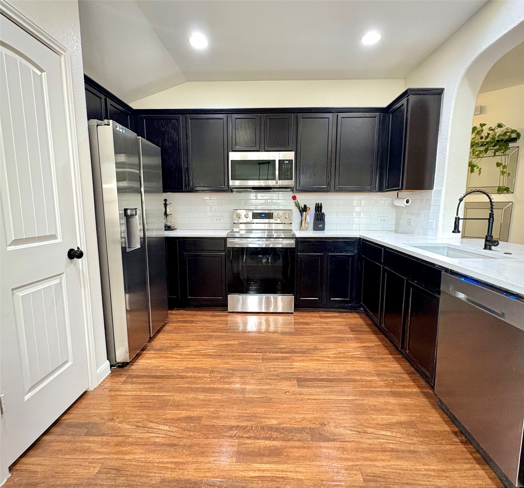 606 Old Peak Road Georgetown, TX 78626 - Photo 6 of 16 a kitchen with stainless steel appliances a sink and a refrigerator