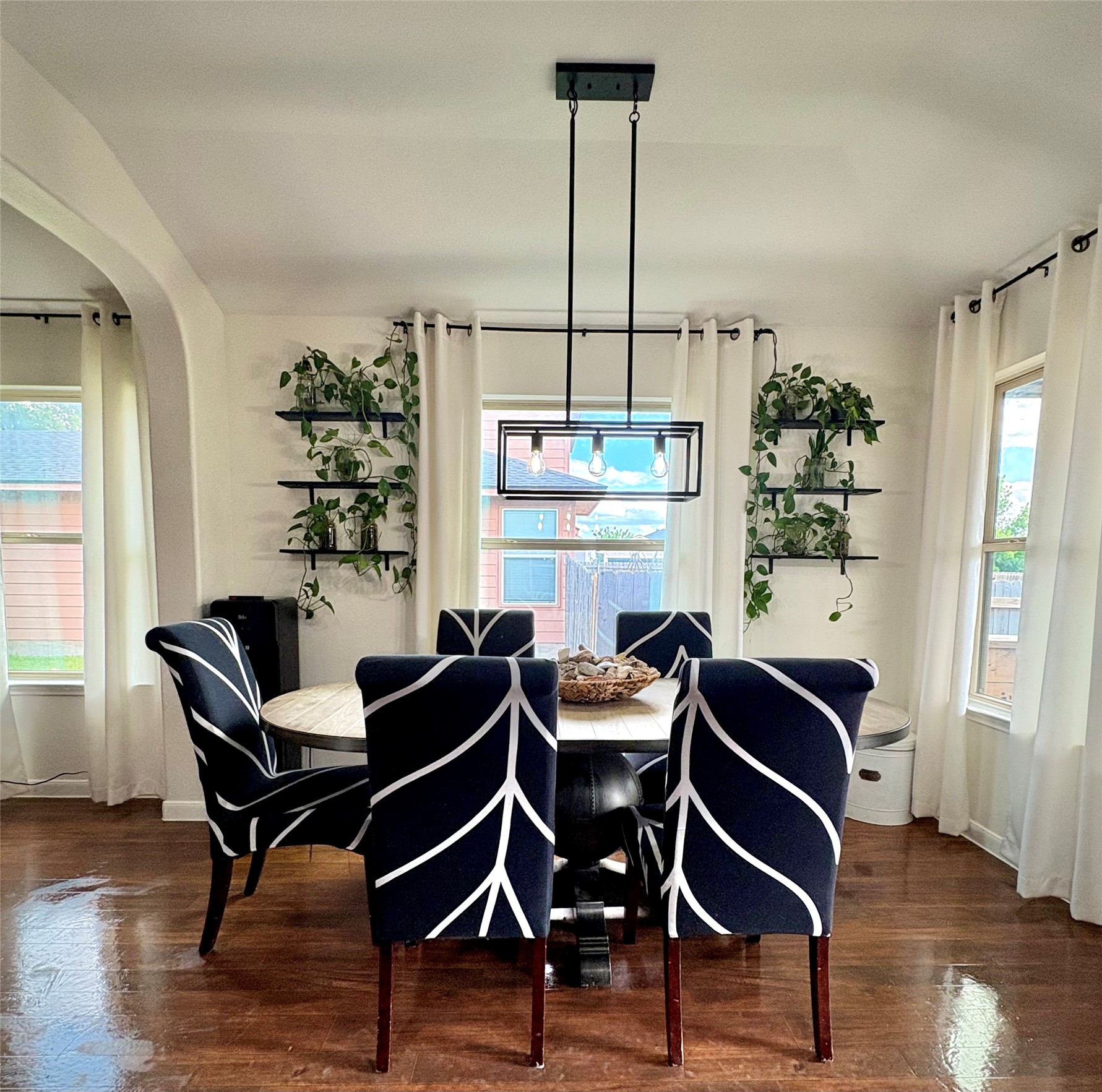 606 Old Peak Road Georgetown, TX 78626 - Photo 7 of 16 a dining room with furniture a chandelier and wooden floor