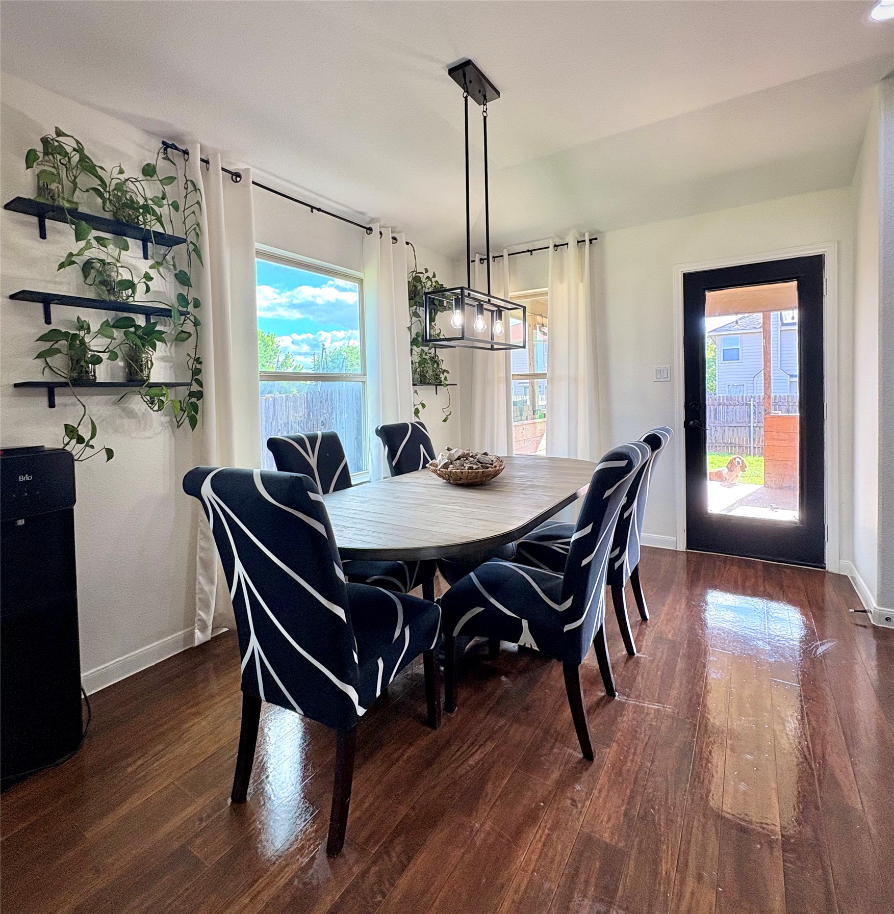 606 Old Peak Road Georgetown, TX 78626 - Photo 8 of 16 a view of a dining room with furniture window and wooden floor
