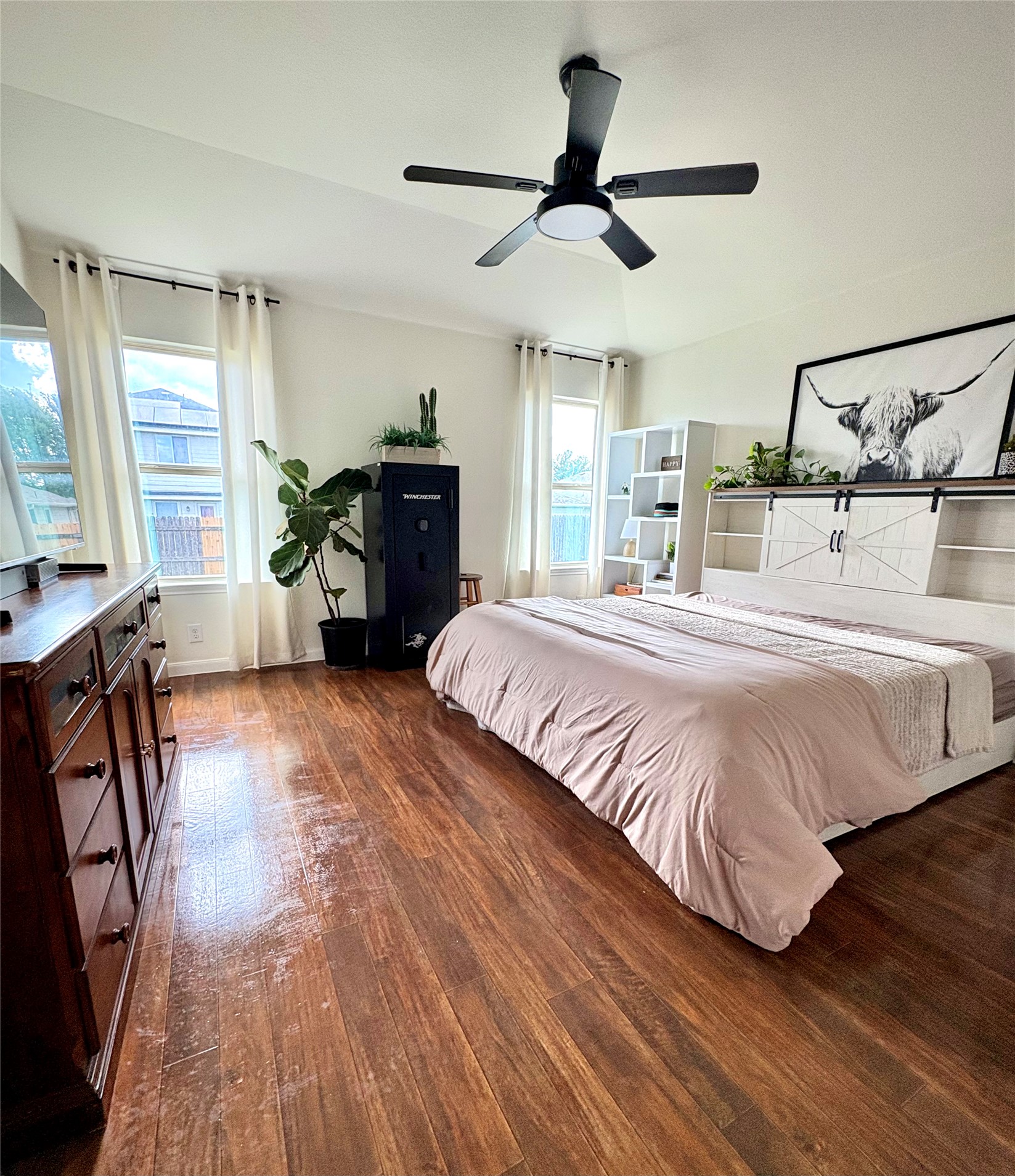 606 Old Peak Road Georgetown, TX 78626 - Photo 10 of 16 a bedroom with a bed dresser and a large window