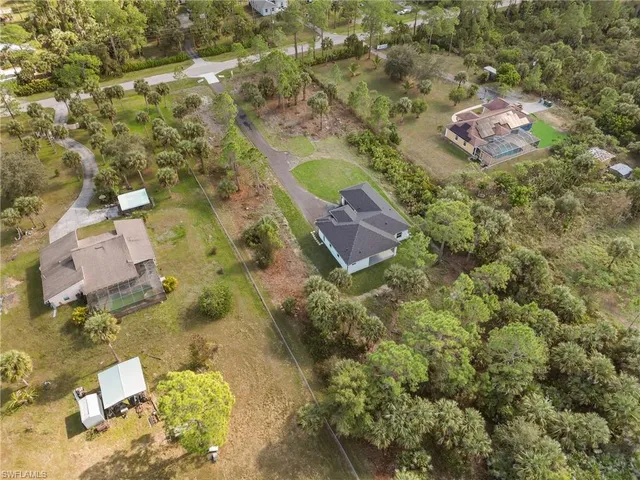 an aerial view of residential house with outdoor space