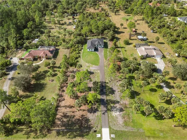 a bird view of residential houses with trees