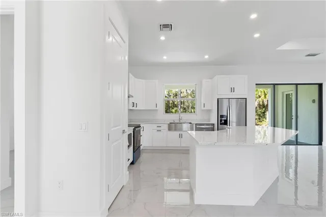 a view of living room with furniture and window