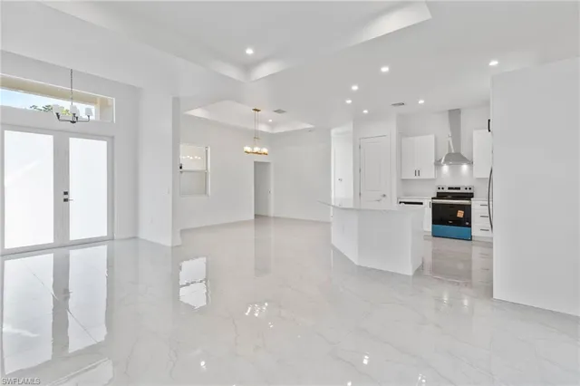 a view of kitchen with furniture and refrigerator
