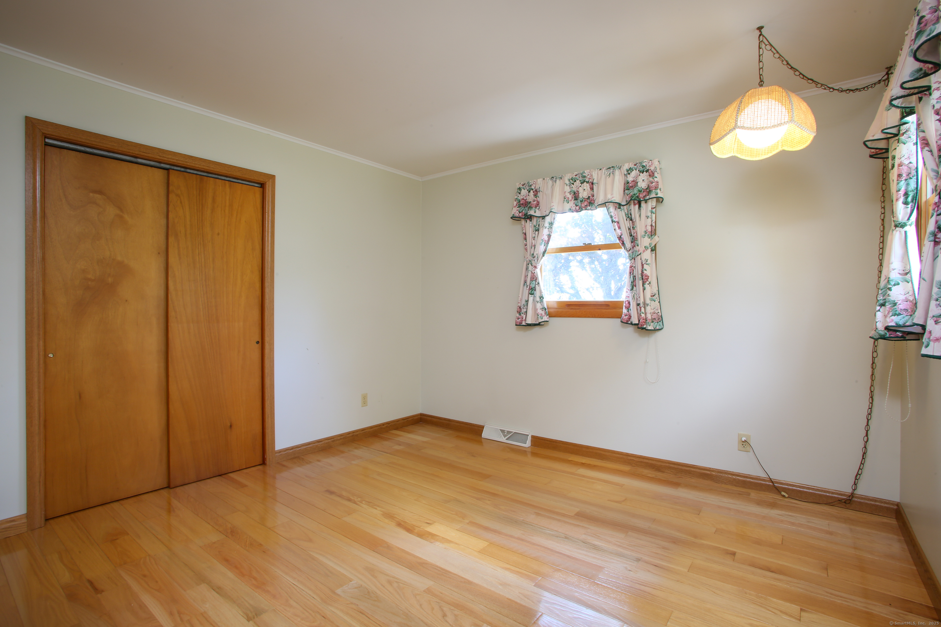76 Fairchild Road Sharon, CT 06069 - Photo 14 of 39 a view of a room that has a window and wooden floor
