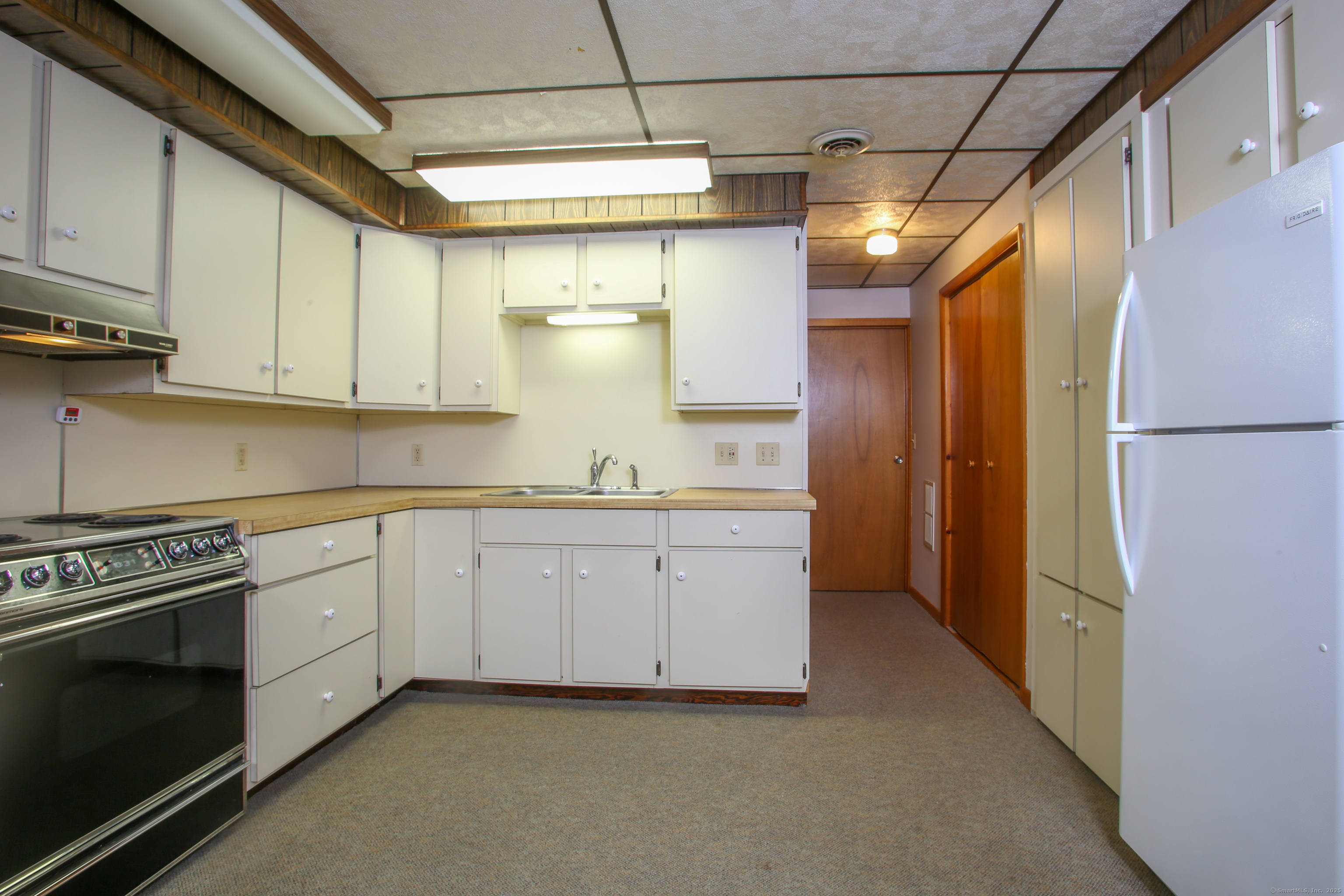 76 Fairchild Road Sharon, CT 06069 - Photo 18 of 39 a kitchen with granite countertop cabinets stainless steel appliances and a counter space