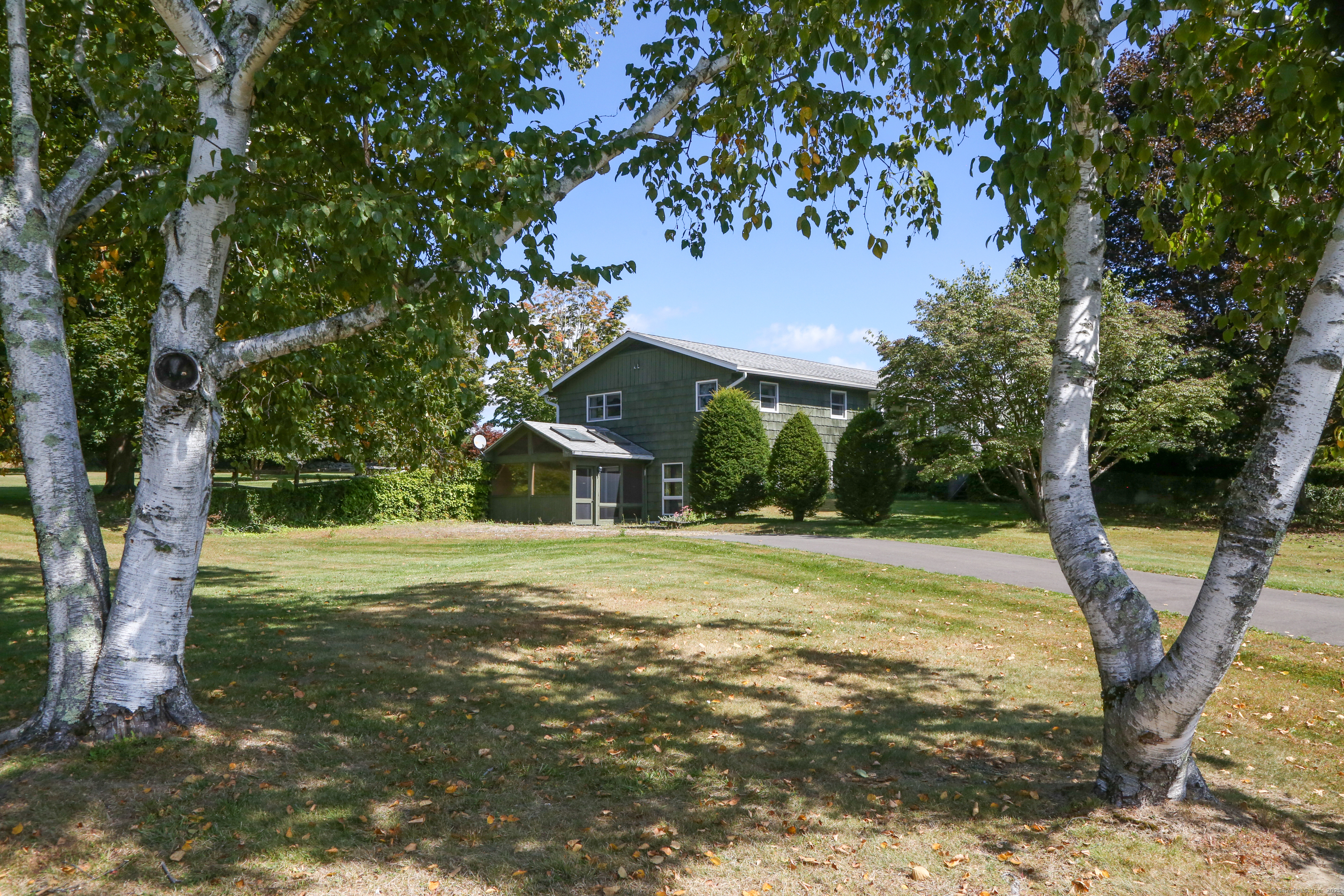 76 Fairchild Road Sharon, CT 06069 - Photo 26 of 39 a front view of a house with garden