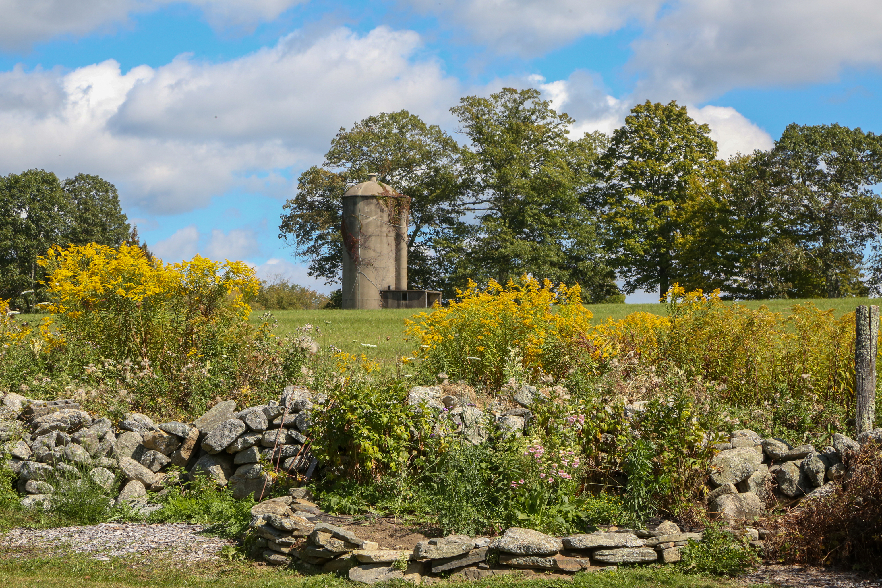 76 Fairchild Road Sharon, CT 06069 - Photo 36 of 39 a view of a lake with a house