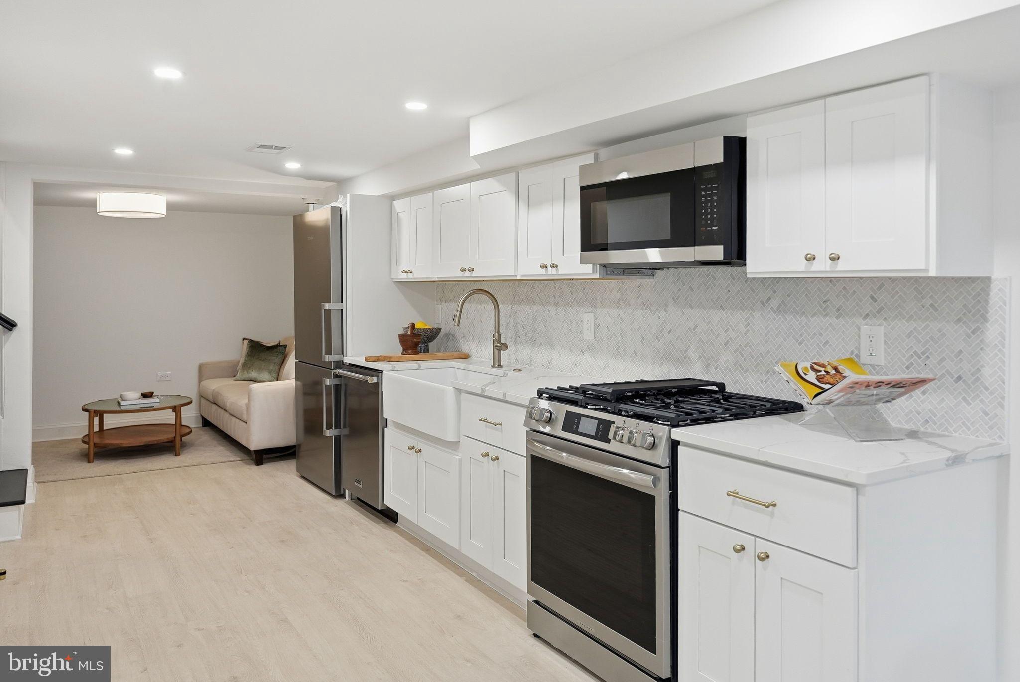 1608 33rd Street Northwest Washington, DC 20007 - Photo 11 of 16 a kitchen with a sink and a stove top oven