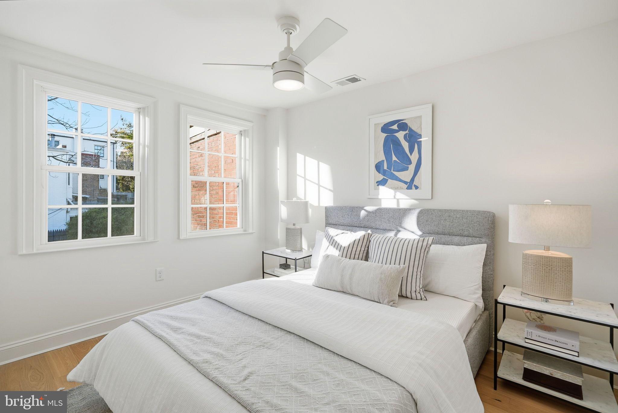 1608 33rd Street Northwest Washington, DC 20007 - Photo 12 of 16 a bedroom with a bed and a large window