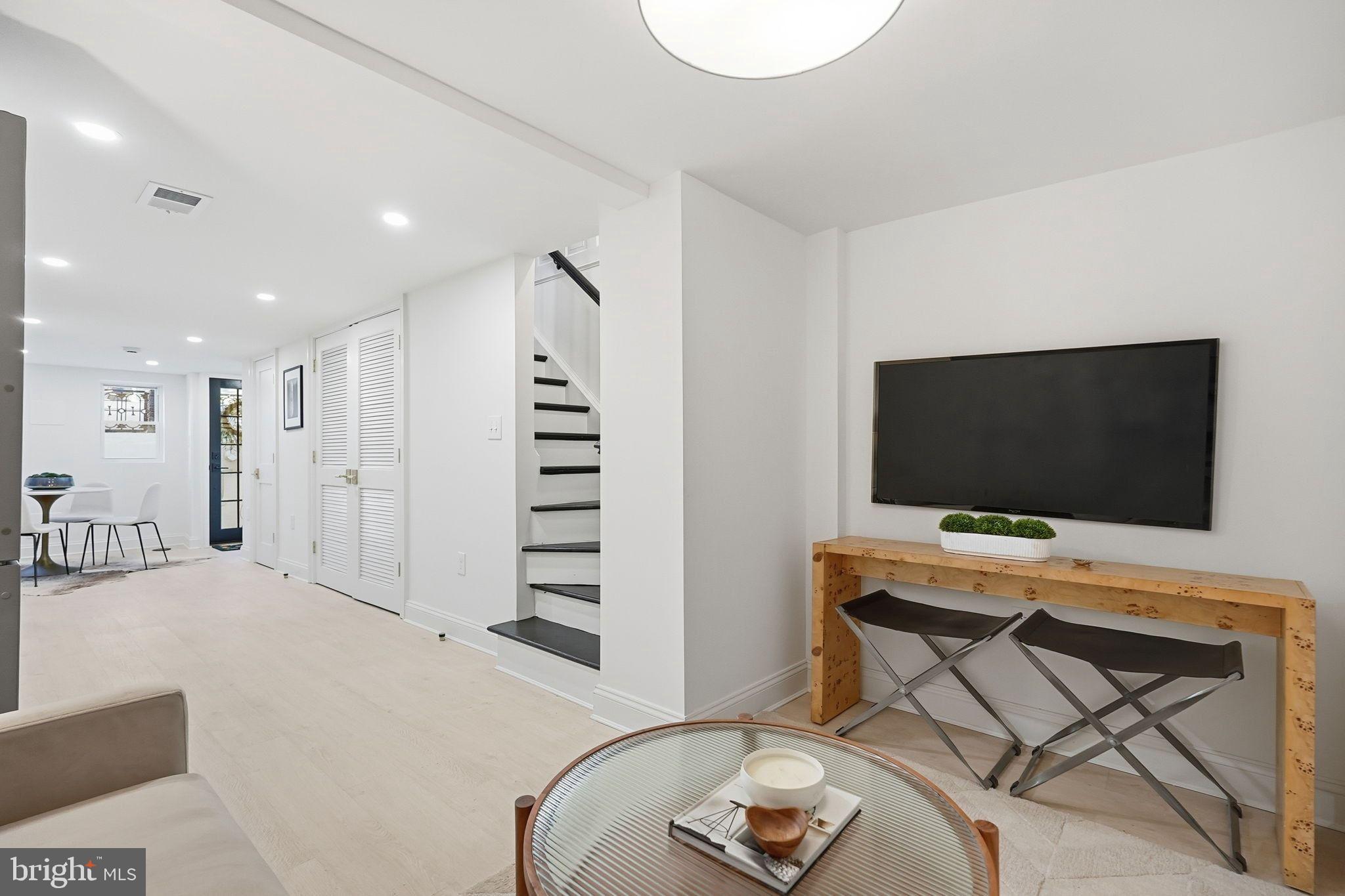 1608 33rd Street Northwest Washington, DC 20007 - Photo 10 of 16 a view of a livingroom with furniture and a flat screen tv